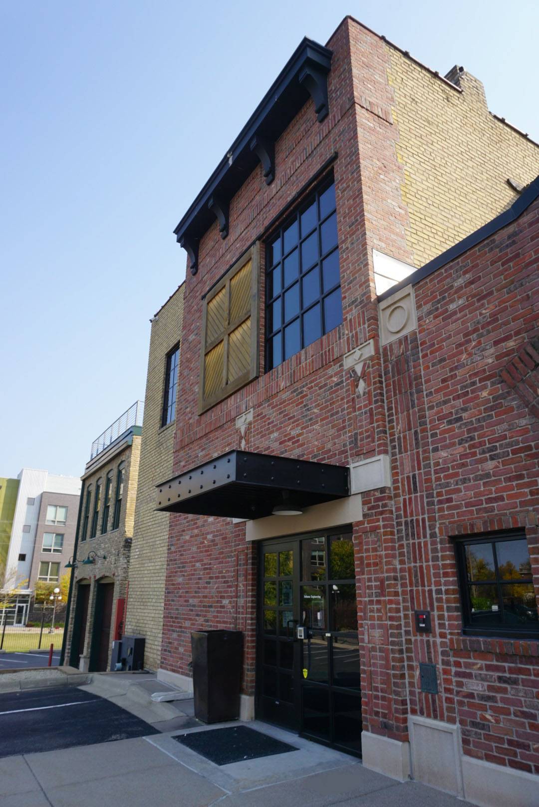 Exterior shot of brick building that houses the Isthmus office