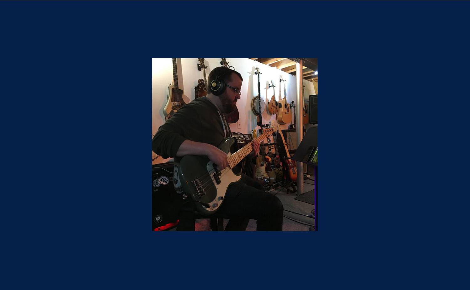 Daren playing a guitar